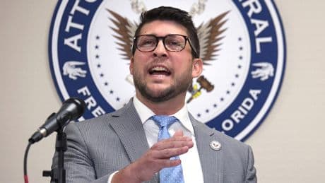 Florida attorney general held in contempt after challenging court's block on immigration law