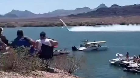 Watch as out-of-control speedboat hurtles through air at 200mph before smashing into lake in front of stunned crowd