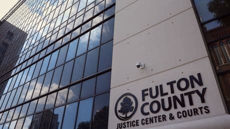 Rap group defense lawyer charged after being accused of tipping off gang member to ditch evidence