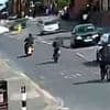 Horrifying moment Audi appears to swerve into path of e-bikes in sickening crash that killed teenage pedestrian and left rider, 18, fighting for his life in hospital