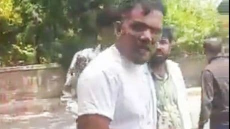 Incredible moment survivor walks away from Air India plane fireball on mobile phone