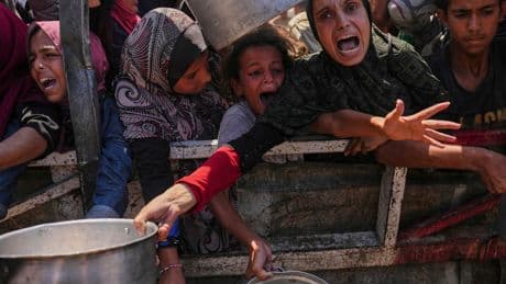 Photos show Palestinians struggling for food as famine grips Gaza's largest city