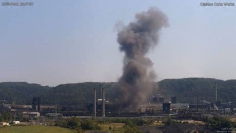One person killed and several remain trapped after explosion at US coke plant
