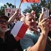 Poland presidential election on a knife-edge as race between liberal pro-EU candidate and right-wing 'hooligan' rival is too close to call after exit polls