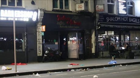 Man and boy arrested on suspicion of arson after restaurant fire leaves two in critical condition