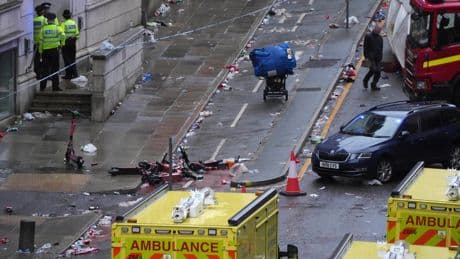 AP PHOTOS: Driver arrested after car plows into celebrating Liverpool fans