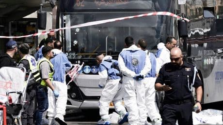 At least five killed and 12 injured after gunmen open fire at bus stop in Jerusalem