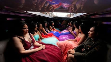 AP PHOTOS: Colombian quinceañeras see dream come true with the support of many, including the police