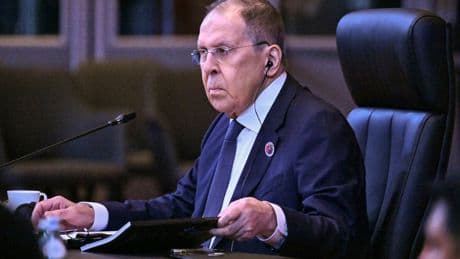 Russian foreign minister wears USSR jumper as he arrives at Trump-Putin summit in Alaska