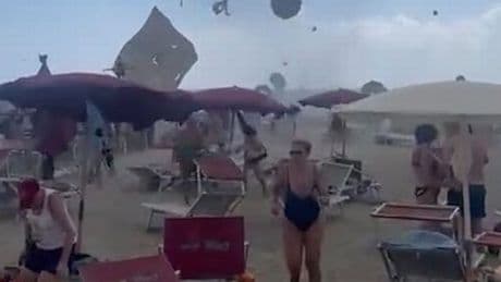 Shocking moment TORNADO sends tourists fleeing on popular Rome beach