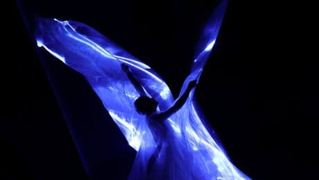 Iris Van Herpen unveils 'living' couture dress of bioluminescent algae in Paris
