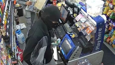 Horror moment meat cleaver wielding thug launches attack on terrified shop staff