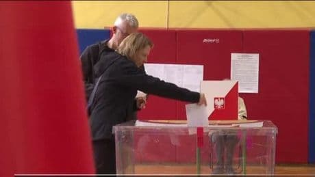 Poles vote for a new president as security concerns loom large