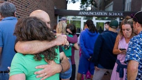 Minneapolis shooting 'heroes' shielded praying school children from bullets