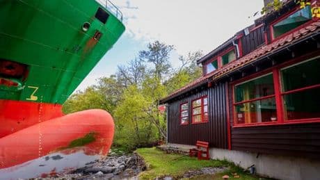 Nightmare in Norway as gigantic cargo ship crashes into local man's front garden