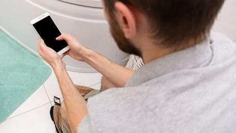 Scientists issue urgent warning over scrolling on your phone while sitting on the toilet - it can increase your risk of haemorrhoids by 46%