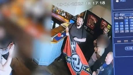 Moment Neo-Nazis celebrate Hitler’s birthday with swastika cake & ‘Fuhrer’ footie shirt after guest stood to be MP