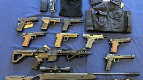 N.B. man charged with robbery, had guns and stolen police badge: RCMP