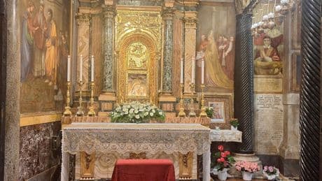 What is the image of the Virgin Mary near the altar?