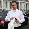Gary Neville cuts a dapper figure in a white tuxedo as he leads the arrivals at pal David Beckham's star-studded 50th birthday bash at plush London venue