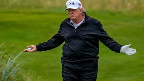 Donald Trump’s caddy drops golf ball moments before president takes a shot