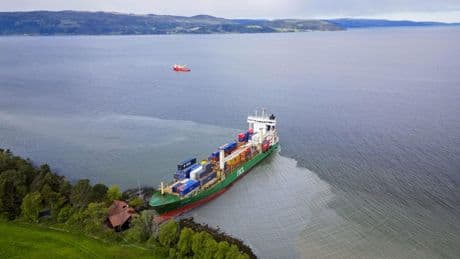 On-duty navigator was allegedly asleep when cargo ship ran aground in Norway and nearly hit a house