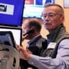 Asian shares mostly higher after US stocks hit another record as Tesla and Nike rally