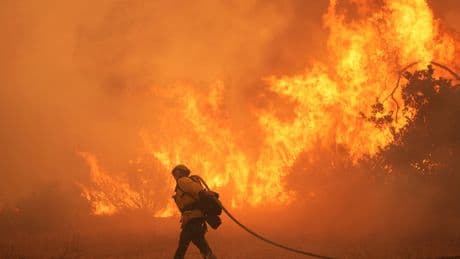 Thousands forced to evacuate in Southern California as fast-moving fire spreads