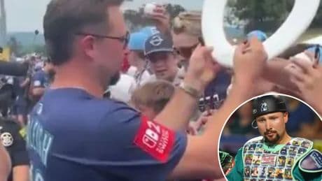 Mariners’ Cal Raleigh signs bathroom item, dons custom chest protector at Little League Classic