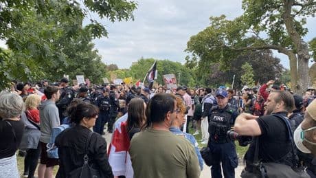 Nine people charged after arrests at competing immigration rallies in Toronto
