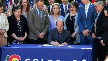 Colorado governor calls for county coroner to resign after inspectors found decaying bodies