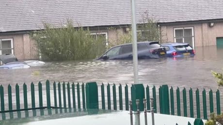 Flash flooding horror as cars submerged under water with 2 major flood alerts