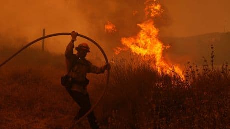 Fast-growing brush fire forces thousands to evacuate north of Los Angeles