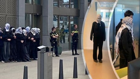 Gemaskerde demonstranten bezetten bibliotheek Universiteit Leiden