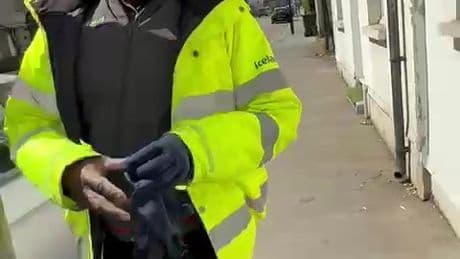 Moment Iceland delivery driver speeds off with customer on his BONNET after he was caught weeing on bins