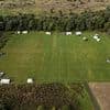 Anger as travellers set up camp with a dozen caravans on public football pitches - forcing children to move their matches