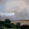 An uncontrolled wildfire sends a cloud of smoke over Spain's capital