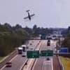 Horrifying moment plane nosedives and crashes into a motorway with cars driving through fireball aftermath in Italy