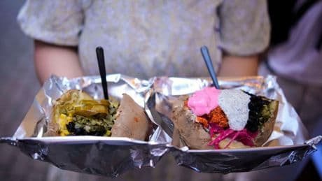 AP PHOTOS: Popular 'kumpir' dish in Turkey is served ahead of International Day of Potato