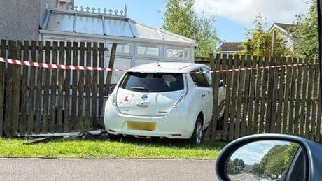 Learner driver smashes car into side of Scots home after ploughing through fence