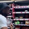 Moment brazen 'thieves' casually walk out of Waitrose with 'handfuls of steak and salmon' - as security guard watches on