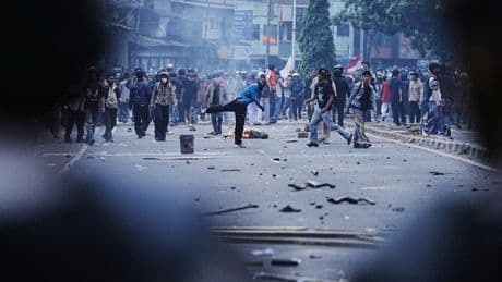 Riot police clash with students protesting lawmakers' allowances in Indonesia