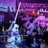 'Star Wars' fans wave lightsabers as an upcoming film gets announced in Japan