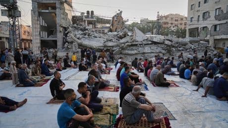 Gaza marks the start of Eid with outdoor prayers amongst the rubble and food growing ever scarcer