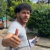 Migrant, 26, who entered the UK with 'grotesque' child abuse videos on his phone gives thumbs up after being spared jail