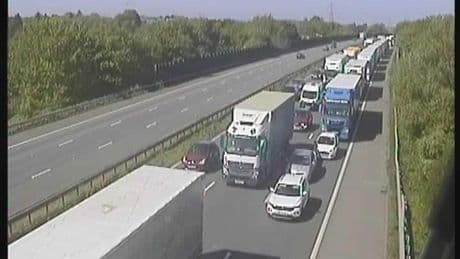 Two major motorways are closed in both directions over lorry fire and crash – as drivers warned of long delays