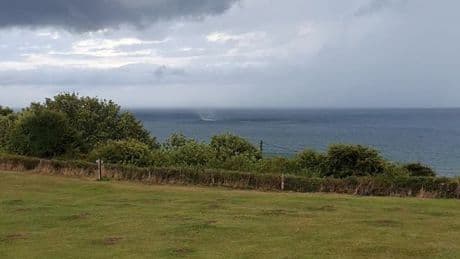 Terrifying moment tourist spots TWO tornados racing towards UK coast amid storm