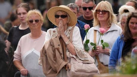 Southport falls silent as town tries to heal a year on from its darkest moment