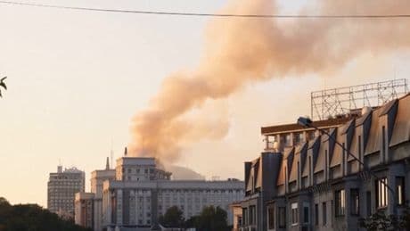 Kyiv government building hit as smoke rises following mass Russian attack