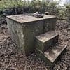 Concrete block in remote wood goes on sale for £20K - but is there more to it than meets the eye?